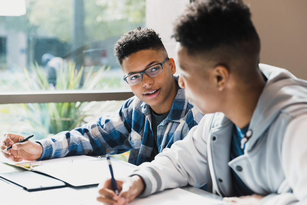 Teen studying with a mentor